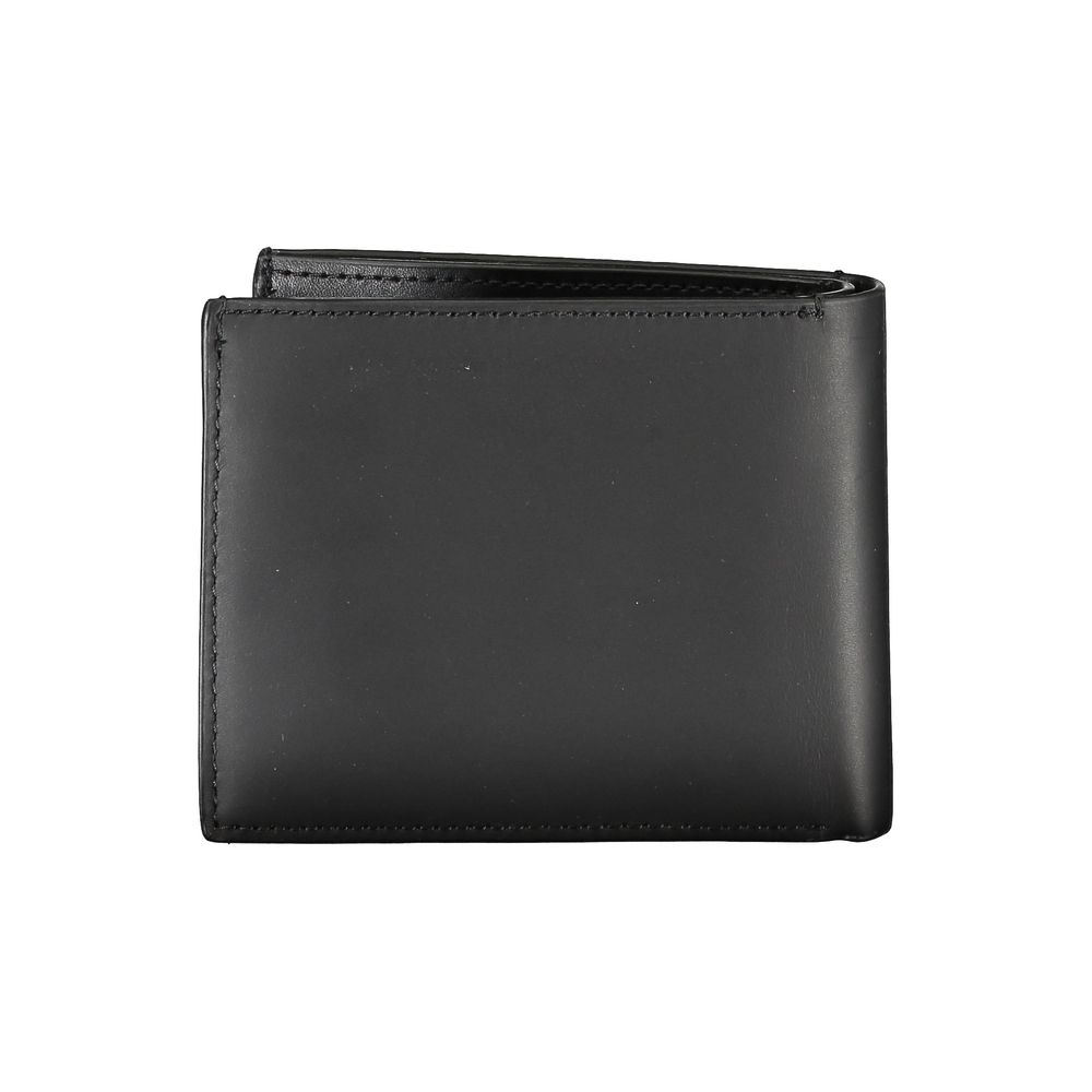 Black Leather RFID Wallet with Coin PurseEmbrace timeless elegance and functionality with the Calvin Klein black leather wallet, the perfect accessory for the discerning gentleman. This sleek wallet features two spacious compartments, a convenient coin pu