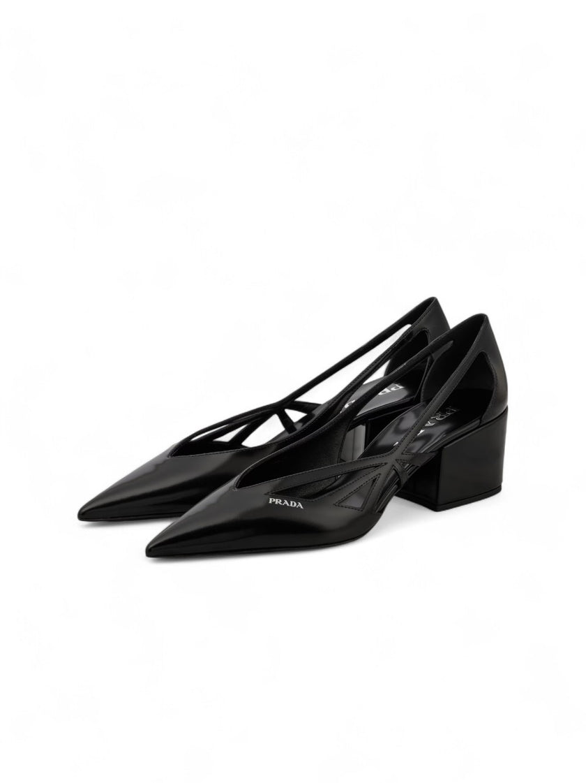 Black Leather Cut-Out Pumps 55PRADA Gorgeous brand new with tags, Satin And Metallic Leather Pumps Model: 1I741N1FDB55 Color: Black Material: Leather Leather upper , Leather lining , Leather insole , Rubber sole , Tapered toe cap, Brand logo Heel : 55 mm