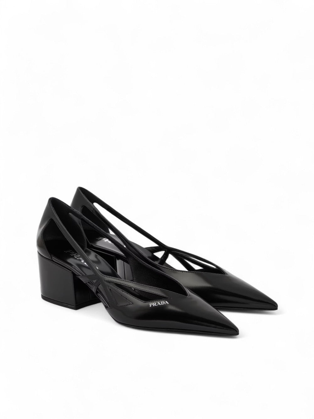 Black Leather Cut-Out Pumps 55PRADA Gorgeous brand new with tags, Satin And Metallic Leather Pumps Model: 1I741N1FDB55 Color: Black Material: Leather Leather upper , Leather lining , Leather insole , Rubber sole , Tapered toe cap, Brand logo Heel : 55 mm