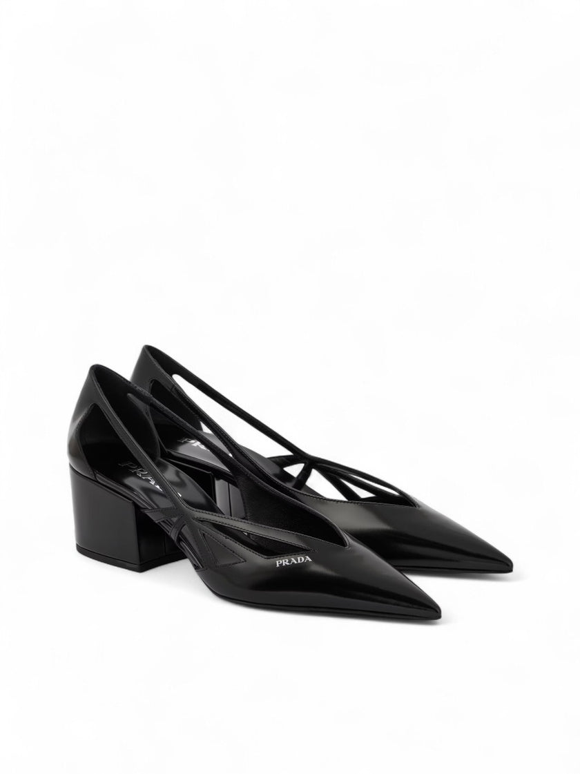 Black Leather Cut-Out Pumps 55PRADA Gorgeous brand new with tags, Satin And Metallic Leather Pumps Model: 1I741N1FDB55 Color: Black Material: Leather Leather upper , Leather lining , Leather insole , Rubber sole , Tapered toe cap, Brand logo Heel : 55 mm