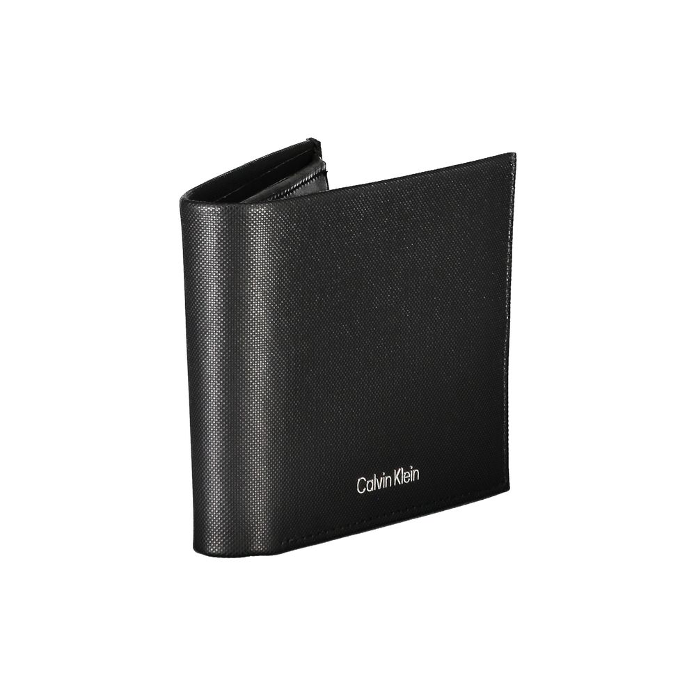 Elegant Black Leather Wallet with RFID BlockingStep up your accessory game with the sleek and practical Calvin Klein black leather wallet. This premium wallet features two compartments for currency, a secure coin purse, and dual card spaces to keep your e