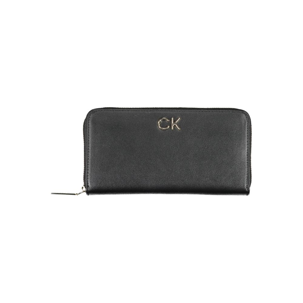 Black Polyethylene Women WalletDiscover the epitome of sophistication with this sleek Calvin Klein wallet. Designed for the modern trendsetter, it boasts five practical compartments, including dedicated card spaces, ensuring your essentials are organized