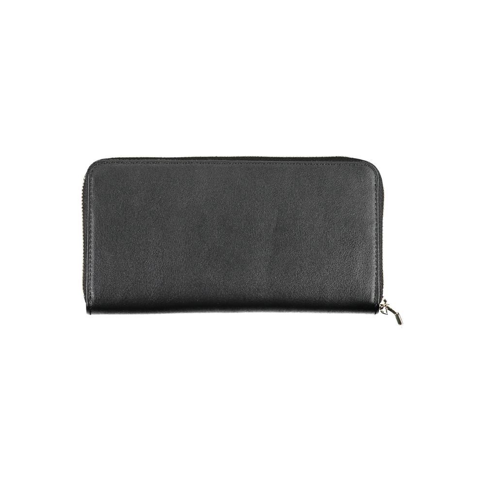 Black Polyethylene Women WalletDiscover the epitome of sophistication with this sleek Calvin Klein wallet. Designed for the modern trendsetter, it boasts five practical compartments, including dedicated card spaces, ensuring your essentials are organized