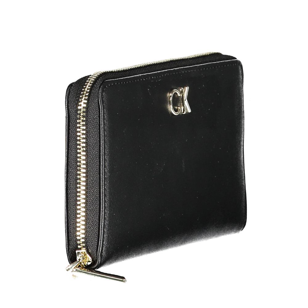 Black Polyethylene Women WalletDiscover the epitome of sophistication with this sleek Calvin Klein wallet. Designed for the modern trendsetter, it boasts five practical compartments, including dedicated card spaces, ensuring your essentials are organized