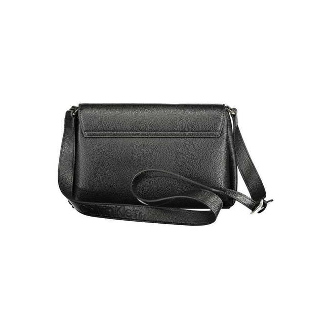 Black Polyester Women HandbagDare to make a sustainable statement with the Calvin Klein handbag, where eco-conscious fashion meets sleek design. Crafted from a blend of recycled materials, this bag features an adjustable shoulder trap for versatile carry,