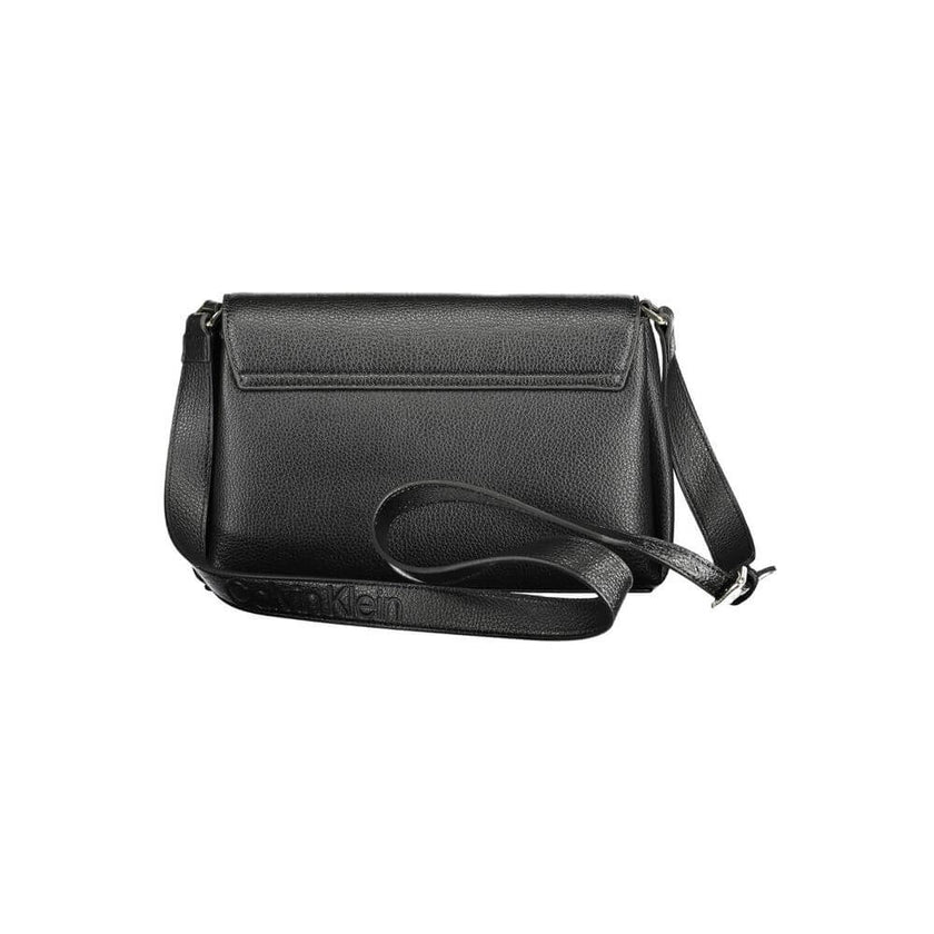 Black Polyester Women HandbagDare to make a sustainable statement with the Calvin Klein handbag, where eco-conscious fashion meets sleek design. Crafted from a blend of recycled materials, this bag features an adjustable shoulder trap for versatile carry,