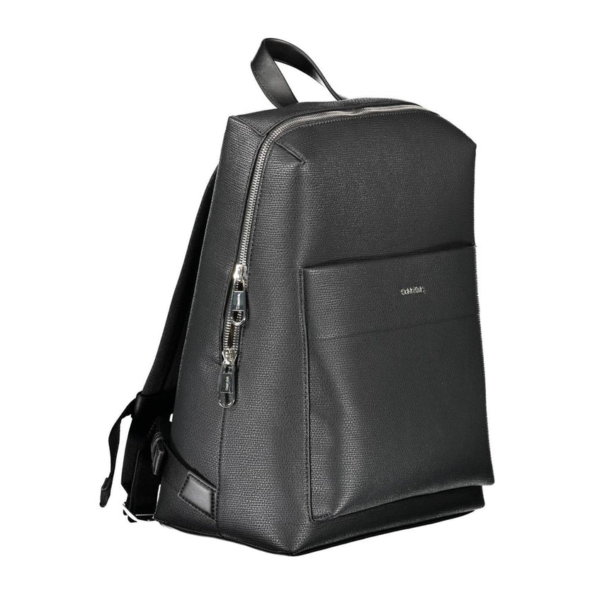 Black Polyester Men BackpackDiscover the epitome of urban sophistication with the Calvin Klein backpack, where functionality meets eco-conscious fashion. This sleek accessory boasts adjustable straps for tailor-made comfort, a convenient external pocket f