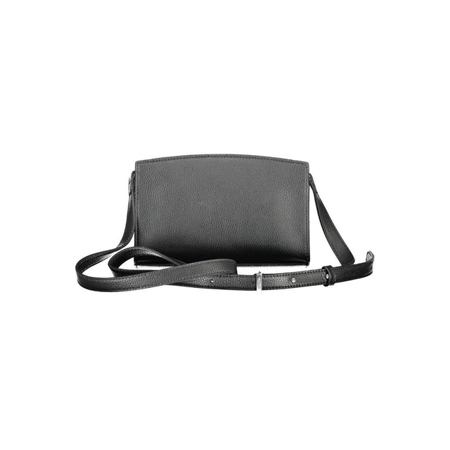 Black Polyester Women HandbagElevate your accessory game with the sleek sophistication of Calvin Klein’s must-have shoulder bag. Boasting an adjustable strap for personalized comfort, this chic piece features a secure zip closure to safeguard your essenti