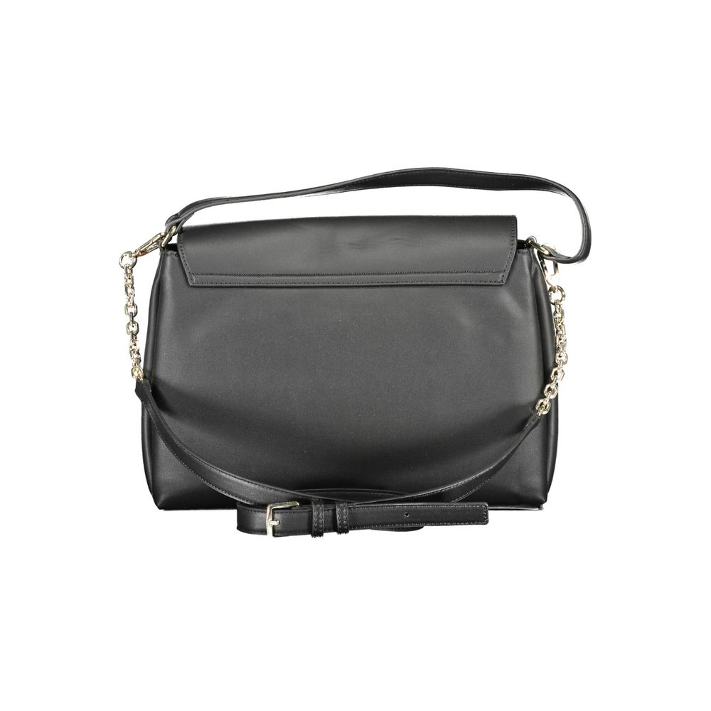 Black Polyester Women HandbagExperience the fusion of eco-conscious design and statement style with this Calvin Klein masterpiece. Its black hue exudes timeless elegance, while the contrasting details provide a touch of modern edge. With dual compartments