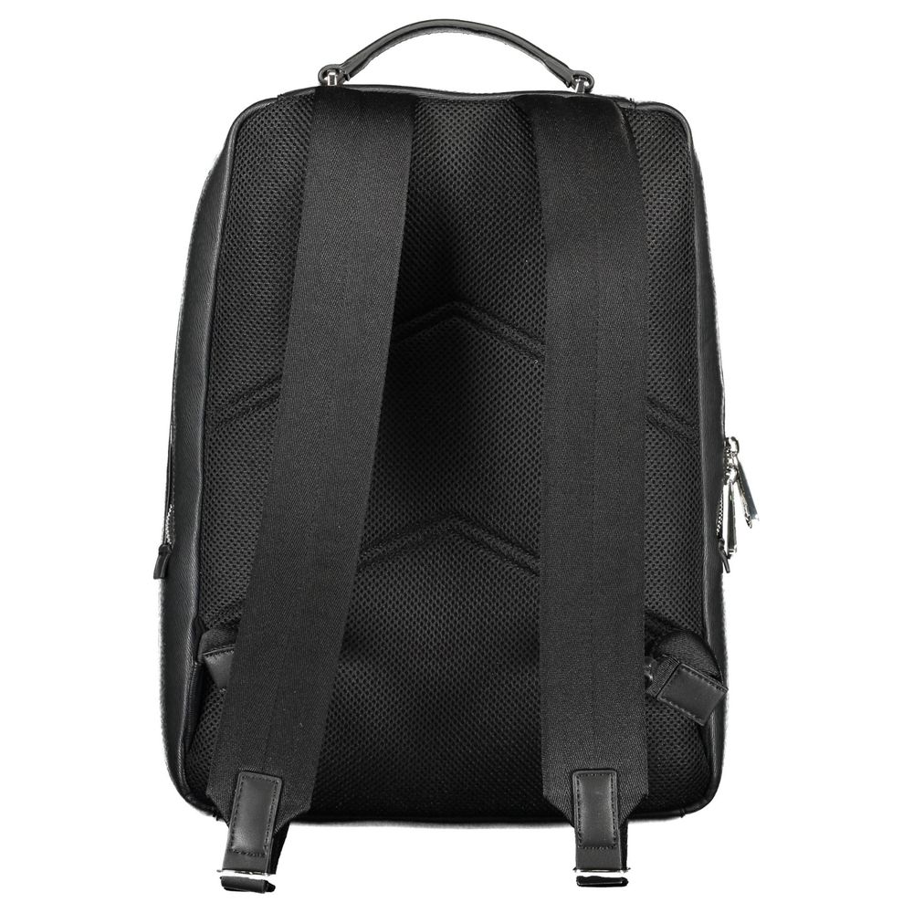 Black Polyester Men BackpackDiscover the epitome of urban sophistication with this Calvin Klein backpack. Crafted with a conscientious approach to fashion, it boasts a sleek black finish complemented by contrasting details, offering a bold statement piece