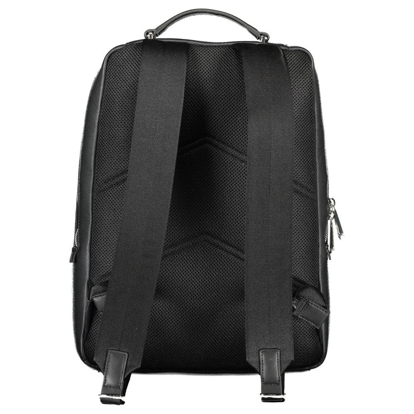 Black Polyester Men BackpackDiscover the epitome of urban sophistication with this Calvin Klein backpack. Crafted with a conscientious approach to fashion, it boasts a sleek black finish complemented by contrasting details, offering a bold statement piece