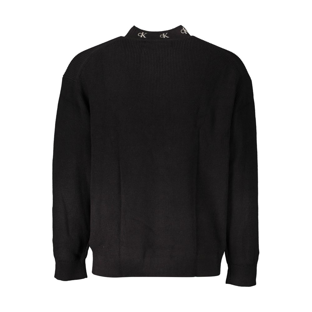 Black Cotton Men SweaterElevate your style with a touch of Calvin Klein sophistication. This sleek black sweater boasts long sleeves, a comfortable round neck, and is adorning with intricate embroidery featuring the iconic Calvin Klein logo. Crafted from