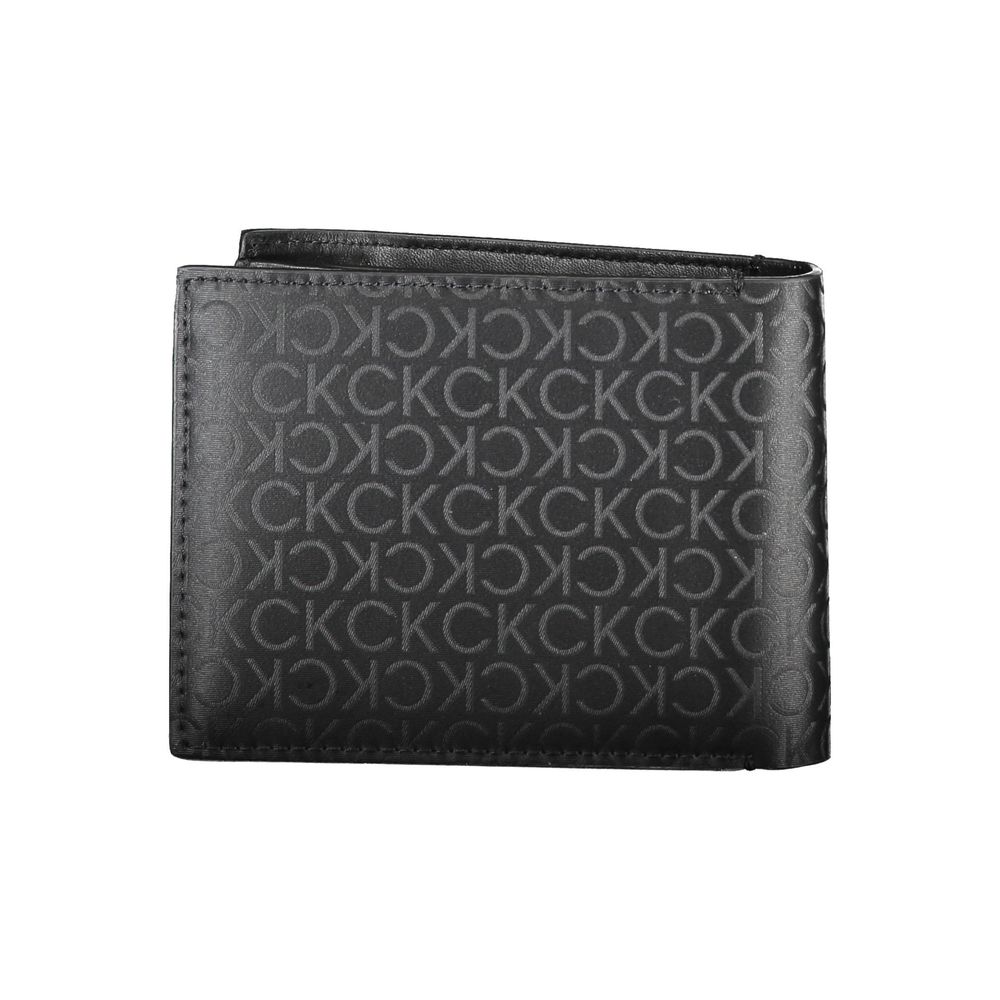Black Polyester Men WalletInfuse your everyday style with a touch of sophistication with this Calvin Klein wallet. Crafted to keep your essentials secure and organized, it features two compartments, a coin purse, and ample space for your cards enhanced wi