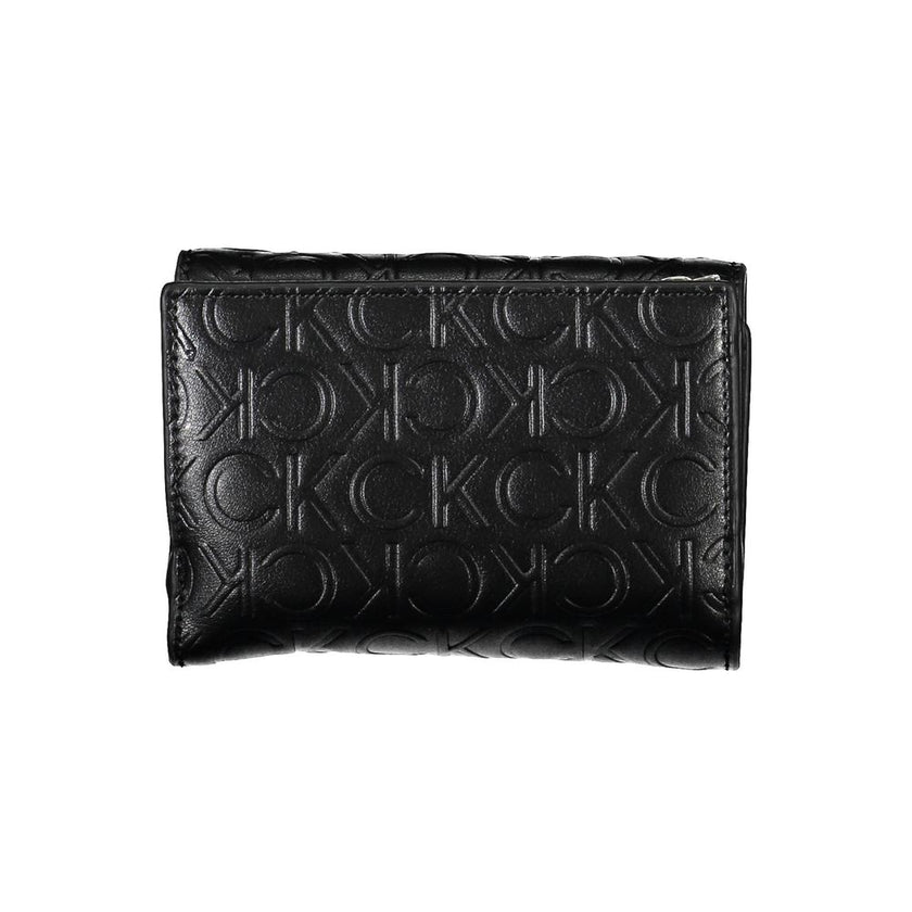 Black Polyethylene Women WalletIndulge in the seamless blend of functionality and style with this Calvin Klein wallet. Crafted to perfection, the accessory boasts two ample compartments, a coin purse, and double spaces to stow away cards with ease. The co