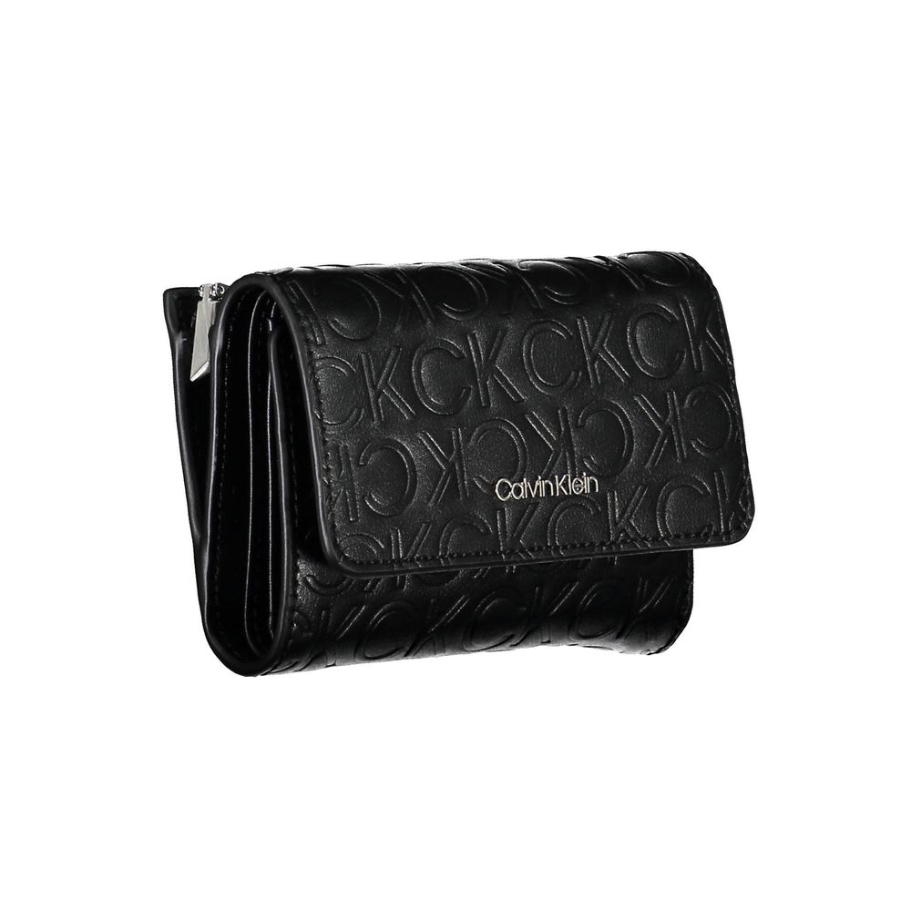 Black Polyethylene Women WalletIndulge in the seamless blend of functionality and style with this Calvin Klein wallet. Crafted to perfection, the accessory boasts two ample compartments, a coin purse, and double spaces to stow away cards with ease. The co