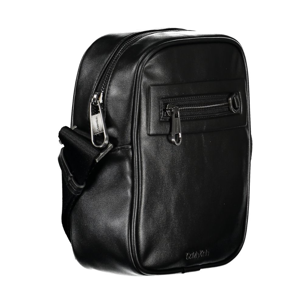 Sleek Urban Black Shoulder BagUpgrade your accessory game with this sleek, environmentally conscious shoulder bag from Calvin Klein. Its refined design boasts an adjustable shoulder strap for a customized fit, and the contrasting details add a touch of el