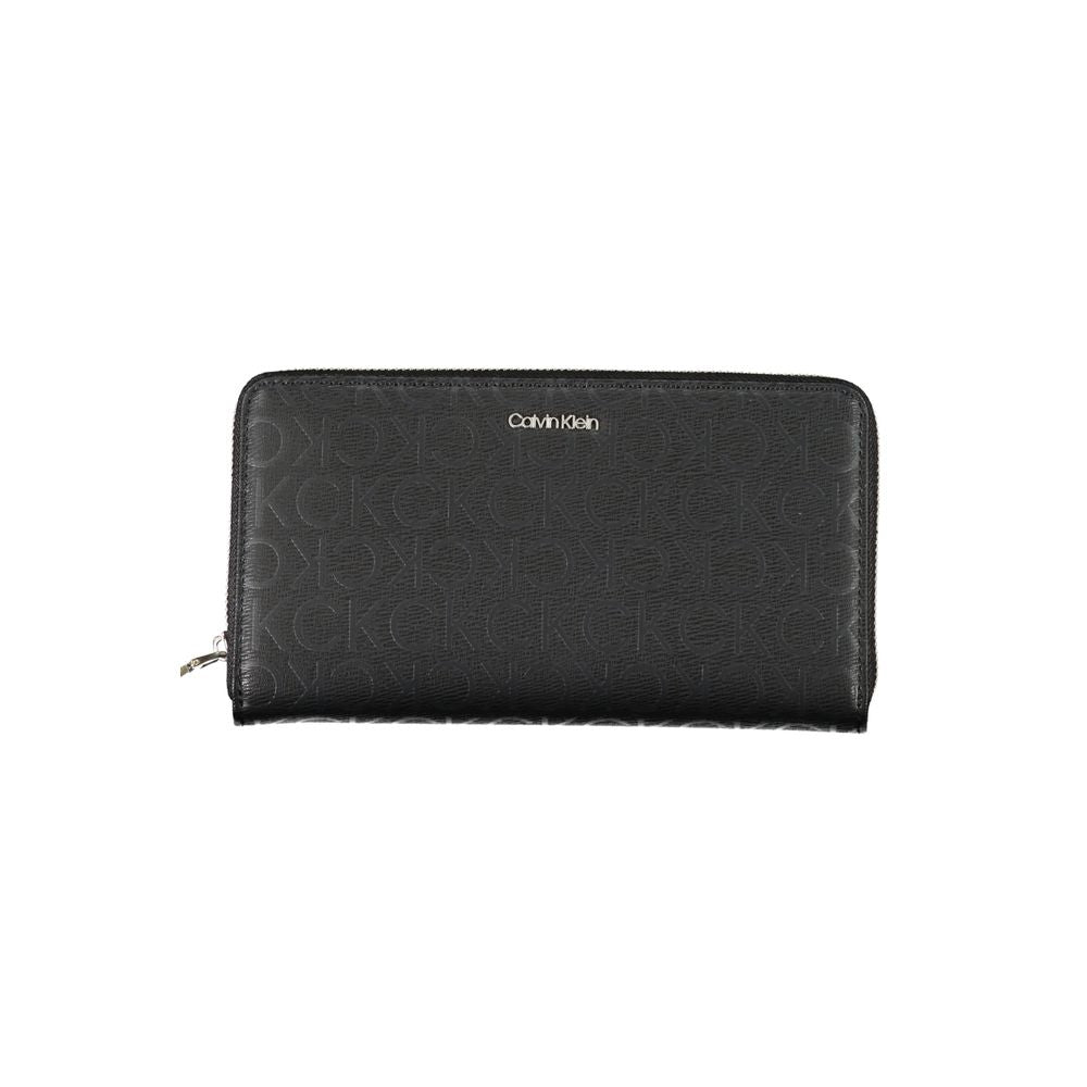 Sleek Designer Three-Compartment WalletImmerse in sophistication with this sleek wallet from Calvin Klein, crafted for the modern individual. Staying organized is effortless with three well-designed compartments, complemented by a handy coin purse and ded