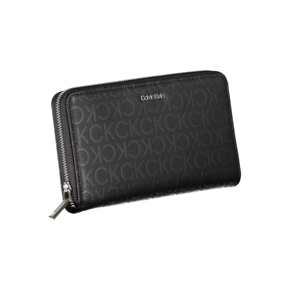 Sleek Designer Three-Compartment WalletImmerse in sophistication with this sleek wallet from Calvin Klein, crafted for the modern individual. Staying organized is effortless with three well-designed compartments, complemented by a handy coin purse and ded