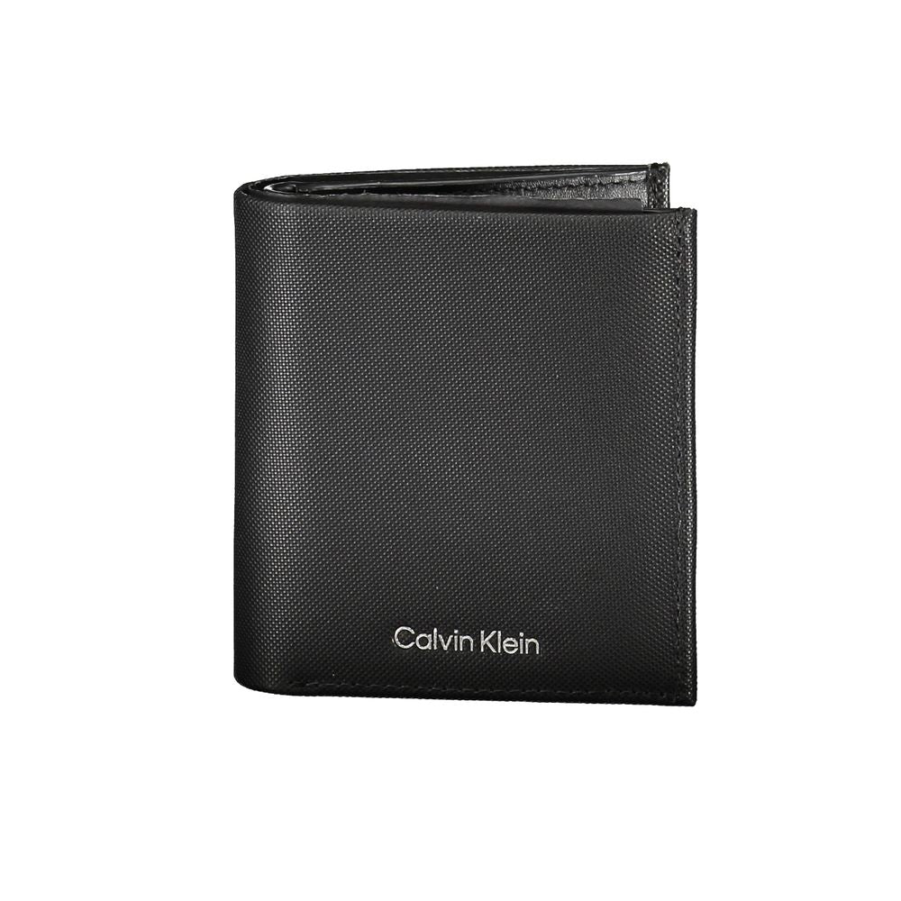 Sleek Leather Bi-Fold Wallet with RFID BlockExperience the perfect blend of functionality and style with this sleek black leather wallet. Designed by the renowned Calvin Klein, this essential accessory offers ample space for all your cards and cash, featu