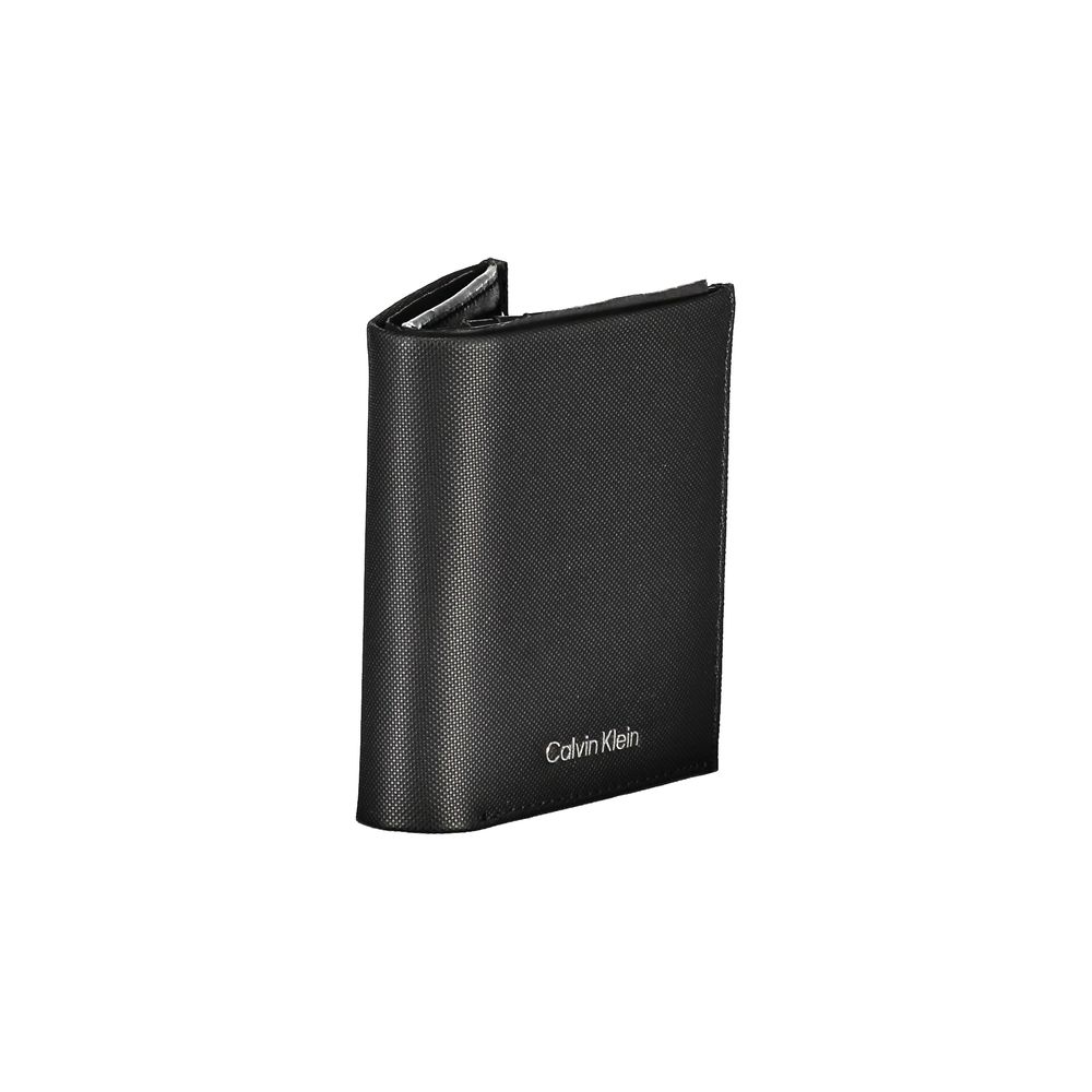 Sleek Leather Bi-Fold Wallet with RFID BlockExperience the perfect blend of functionality and style with this sleek black leather wallet. Designed by the renowned Calvin Klein, this essential accessory offers ample space for all your cards and cash, featu