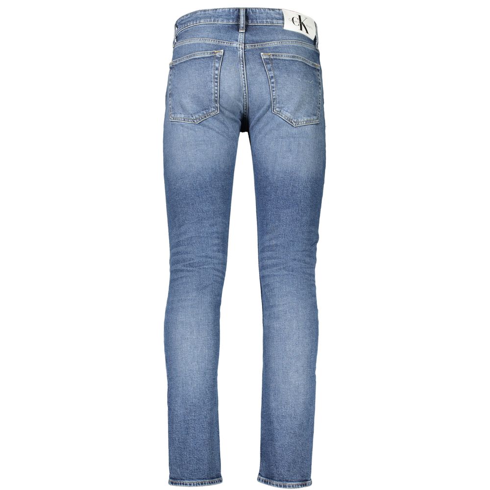 Blue Cotton Men JeansUnleash the epitome of suave style with Calvin Klein’s Slim Taper Jeans. These jeans, designed for the fashion-forward, feature a sleek silhouette that tapers perfectly to display a modern edge. Crafted with a conscience, 20% recycled