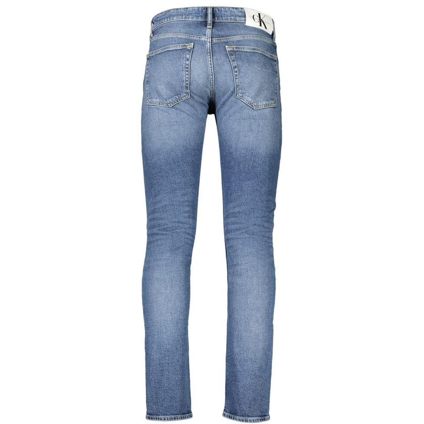 Blue Cotton Men JeansUnleash the epitome of suave style with Calvin Klein’s Slim Taper Jeans. These jeans, designed for the fashion-forward, feature a sleek silhouette that tapers perfectly to display a modern edge. Crafted with a conscience, 20% recycled
