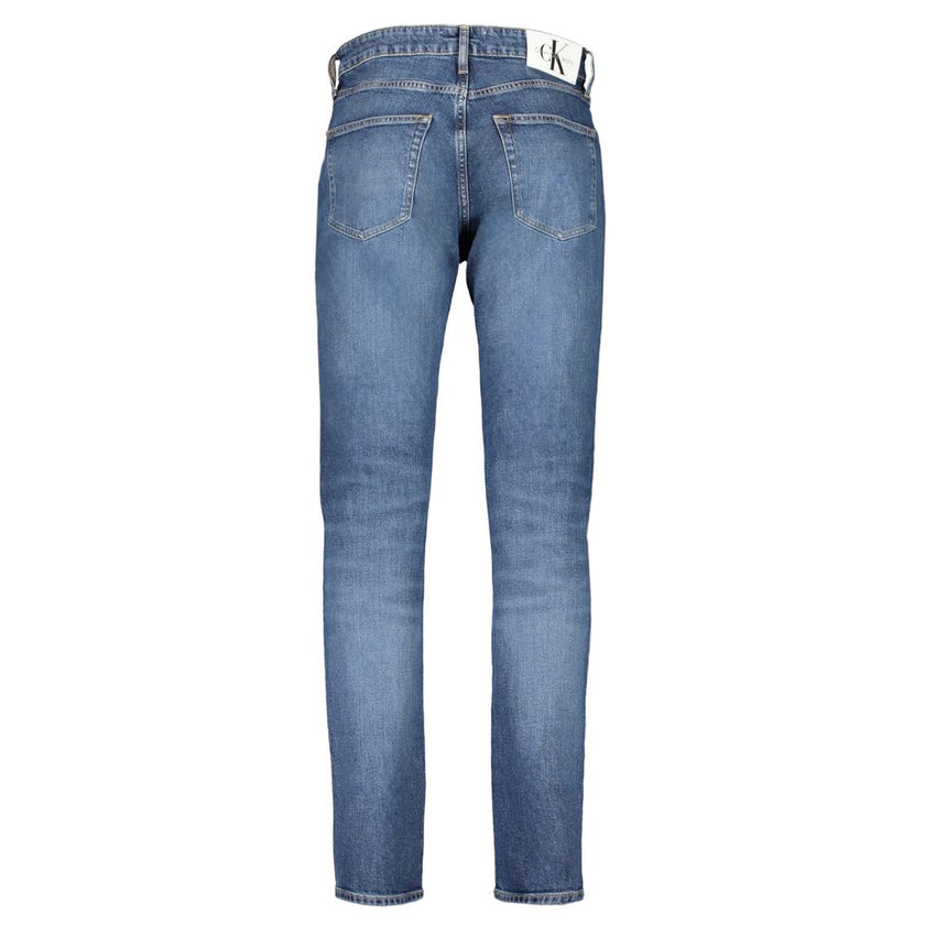 Blue Cotton Men JeansElevate your denim repertoire with the quintessence of contemporary style—Calvin Klein’s DAD JEANS. These authentic jeans boast a classic 5-pocket design infused with a modern washed effect, ensuring you stand out in any crowd. Crafte