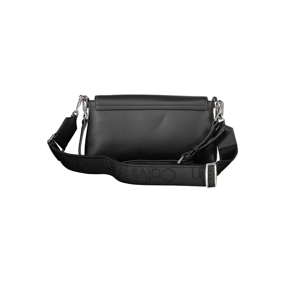 Black Polyester Women HandbagIndulge in the epitome of sophistication with Calvin Klein’s handbag, where functionality meets high fashion. This exquisite piece brings an air of exclusive elegance to your arm. It’s crafted with a blend of polyester and pol