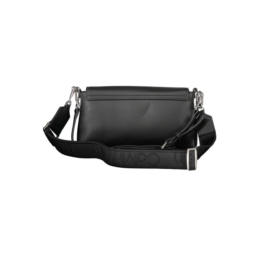 Black Polyester Women HandbagIndulge in the epitome of sophistication with Calvin Klein’s handbag, where functionality meets high fashion. This exquisite piece brings an air of exclusive elegance to your arm. It’s crafted with a blend of polyester and pol