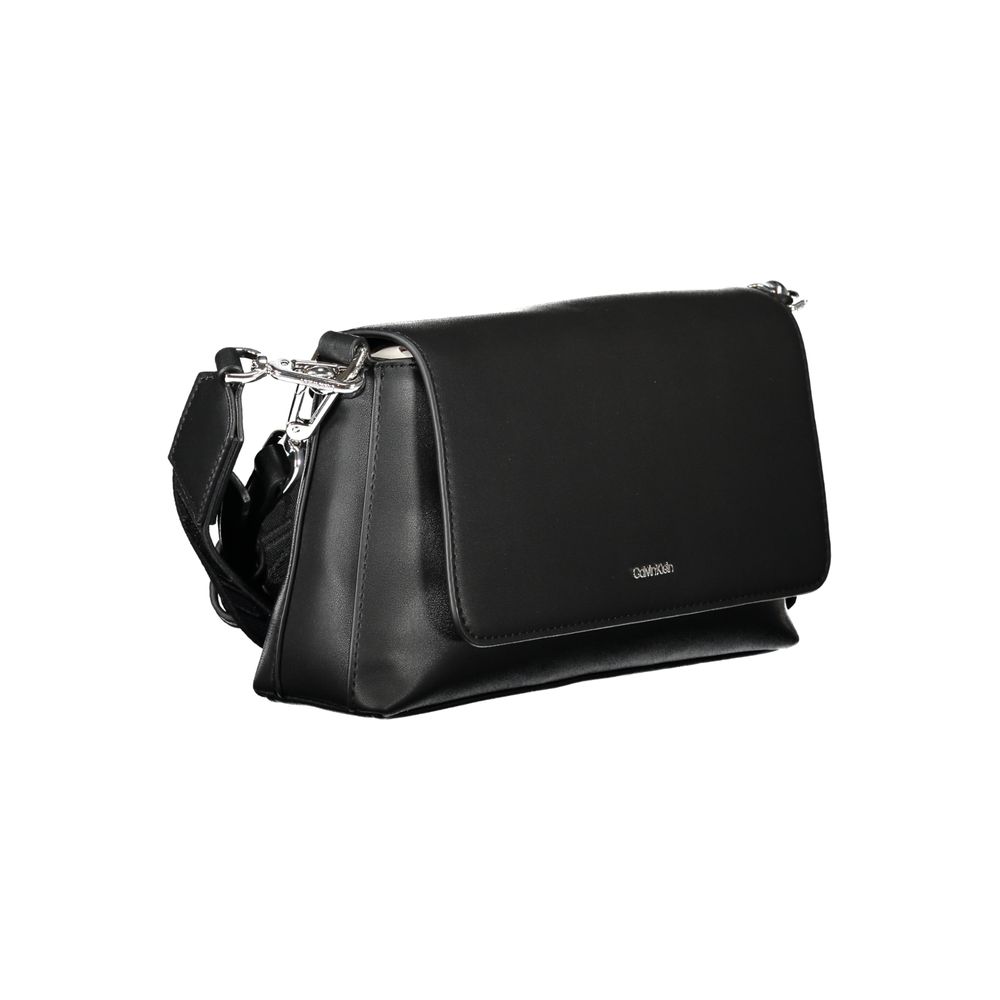Black Polyester Women HandbagIndulge in the epitome of sophistication with Calvin Klein’s handbag, where functionality meets high fashion. This exquisite piece brings an air of exclusive elegance to your arm. It’s crafted with a blend of polyester and pol