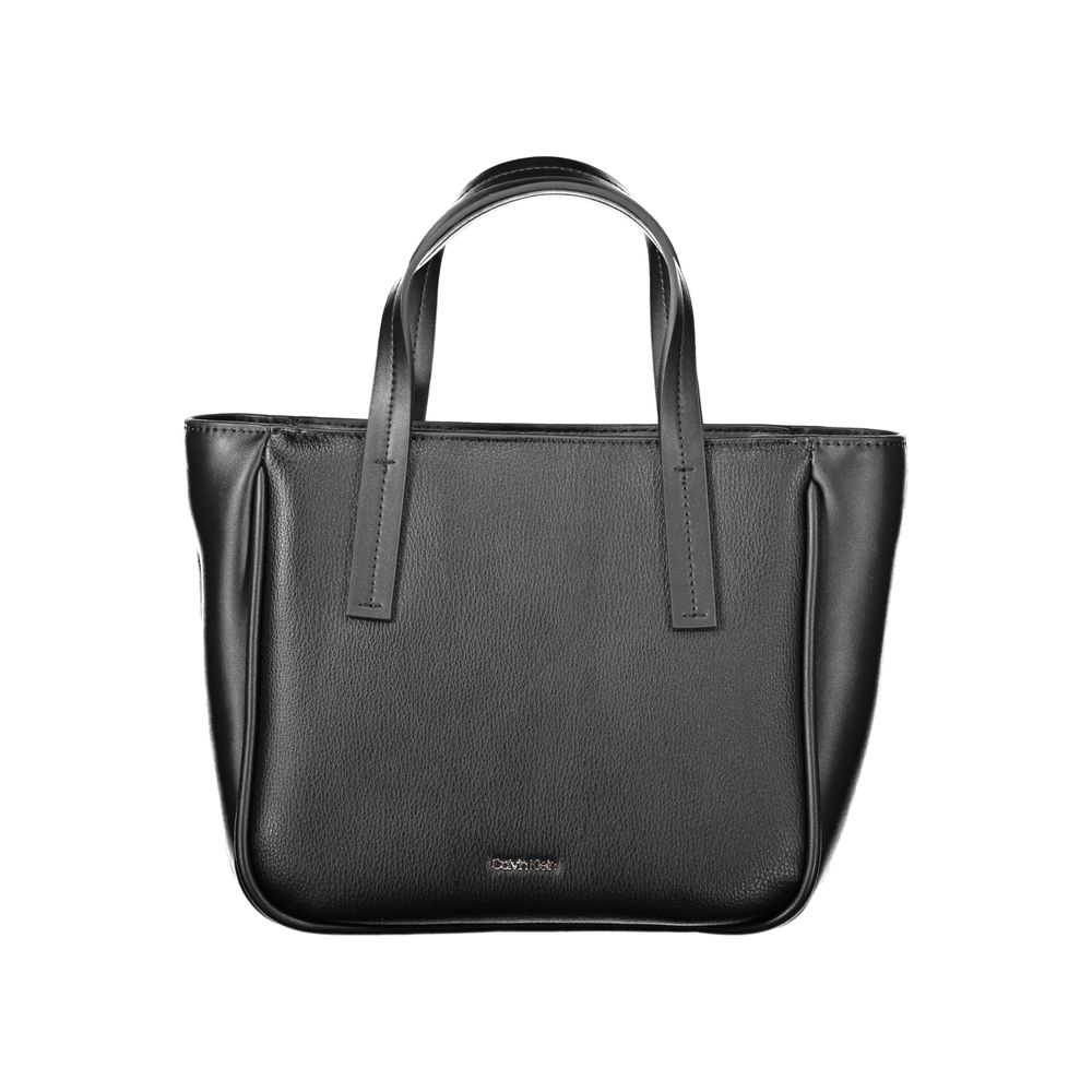 Black Polyethylene Women HandbagElevate your accessory game with this sleek Calvin Klein handbag, a statement piece blending utility and style. Crafted with a modern mixture of 33% Polyester and 67% Polyethylene, this exquisite black bag boasts two handle