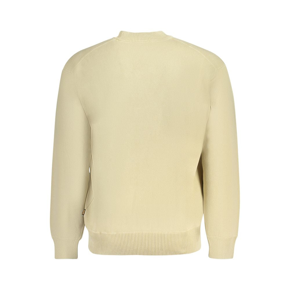 Beige Cotton Men SweaterElevate your wardrobe with this exquisite Hugo Boss sweater. Meticulously crafted from 100% regenerative cotton, this long-sleeved crew neck is more than just a garment; it’s a statement. Designed with the modern man in mind, it bo