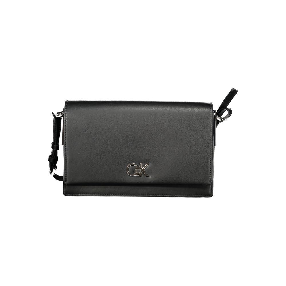 Black Polyester Women HandbagExperience the pinnacle of urban sophistication with this Calvin Klein masterpiece. Crafted for the eco-conscious fashionista, this sleek bag marries functionality with high-end style, featuring an adjustable shoulder handle a