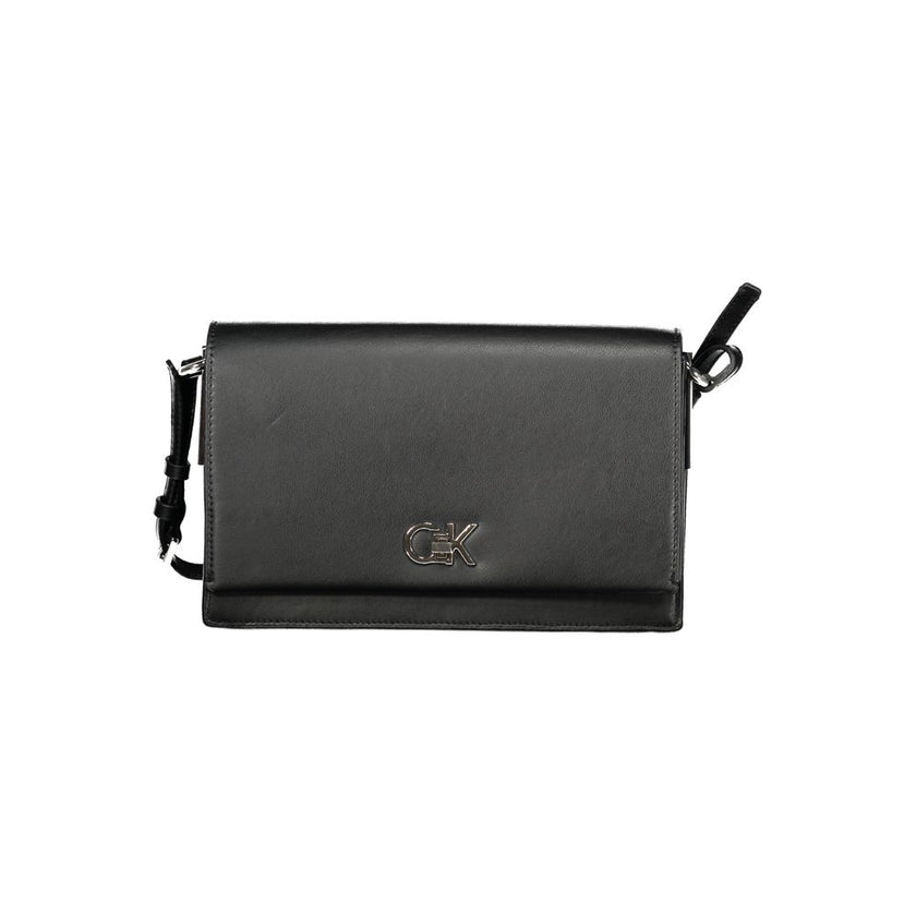Black Polyester Women HandbagExperience the pinnacle of urban sophistication with this Calvin Klein masterpiece. Crafted for the eco-conscious fashionista, this sleek bag marries functionality with high-end style, featuring an adjustable shoulder handle a