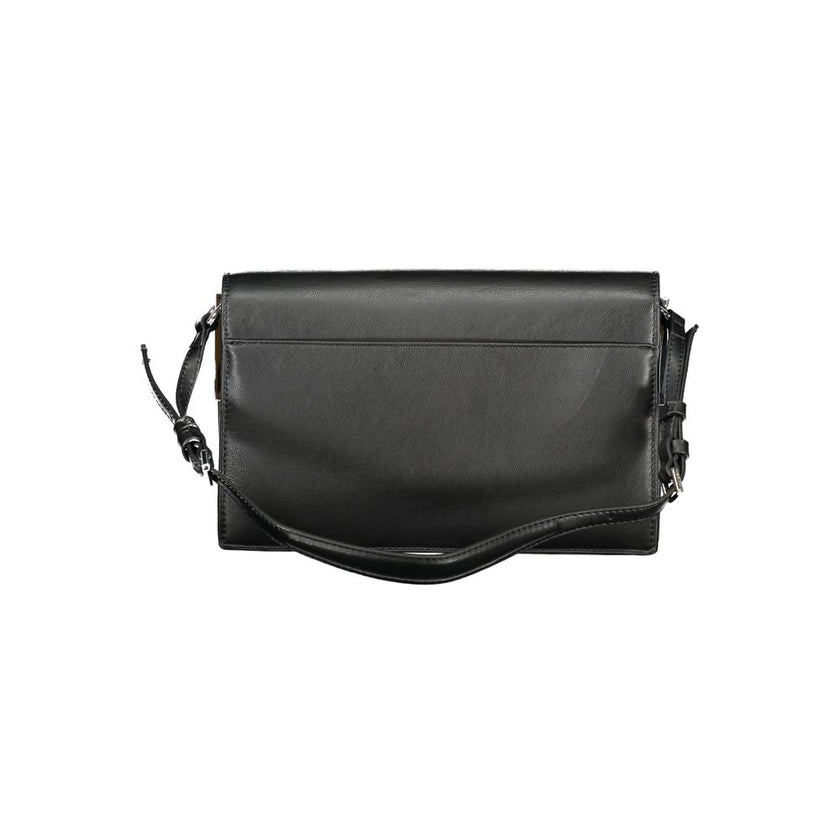 Black Polyester Women HandbagExperience the pinnacle of urban sophistication with this Calvin Klein masterpiece. Crafted for the eco-conscious fashionista, this sleek bag marries functionality with high-end style, featuring an adjustable shoulder handle a