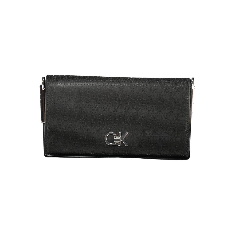 Black Polyester Women HandbagElevate your accessory game with this chic Calvin Klein shoulder bag. Designed to cater to both style and functionality, it flaunts two spacious compartments, a secure central pocket, and a card-formed pocket for your essentia