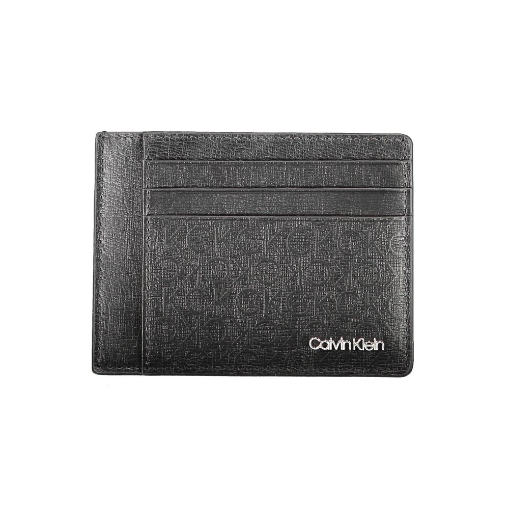 Black Polyester Men WalletElevate your essentials with the sleek sophistication of a Calvin Klein card holder. Designed with the modern man in mind, this card holder boasts functionality with a central pocket and an additional handle holder. The RFID bloc