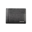 Black Polyester Men WalletElevate your essentials with the sleek sophistication of a Calvin Klein card holder. Designed with the modern man in mind, this card holder boasts functionality with a central pocket and an additional handle holder. The RFID bloc