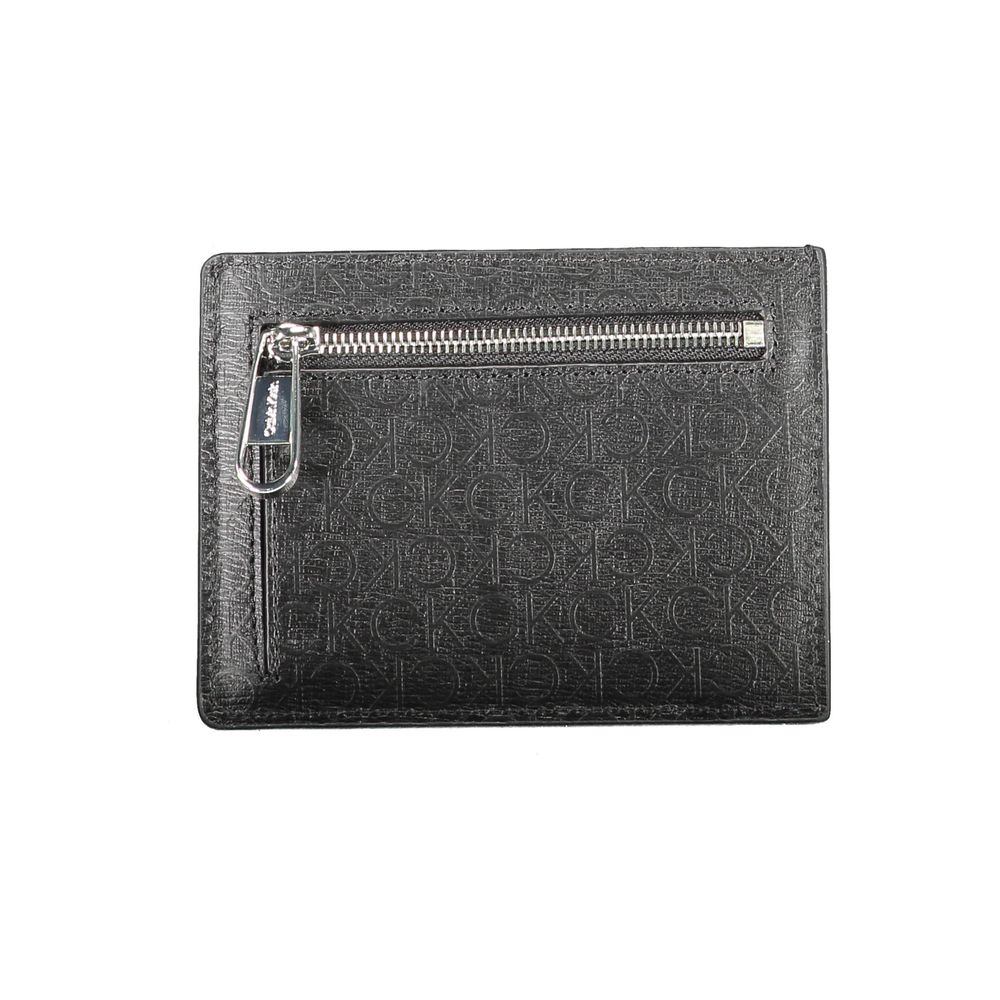 Black Polyester Men WalletElevate your essentials with the sleek sophistication of a Calvin Klein card holder. Designed with the modern man in mind, this card holder boasts functionality with a central pocket and an additional handle holder. The RFID bloc