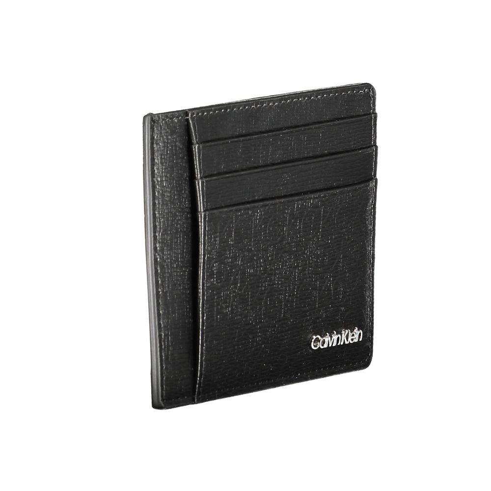 Black Polyester Men WalletElevate your essentials with the sleek sophistication of a Calvin Klein card holder. Designed with the modern man in mind, this card holder boasts functionality with a central pocket and an additional handle holder. The RFID bloc