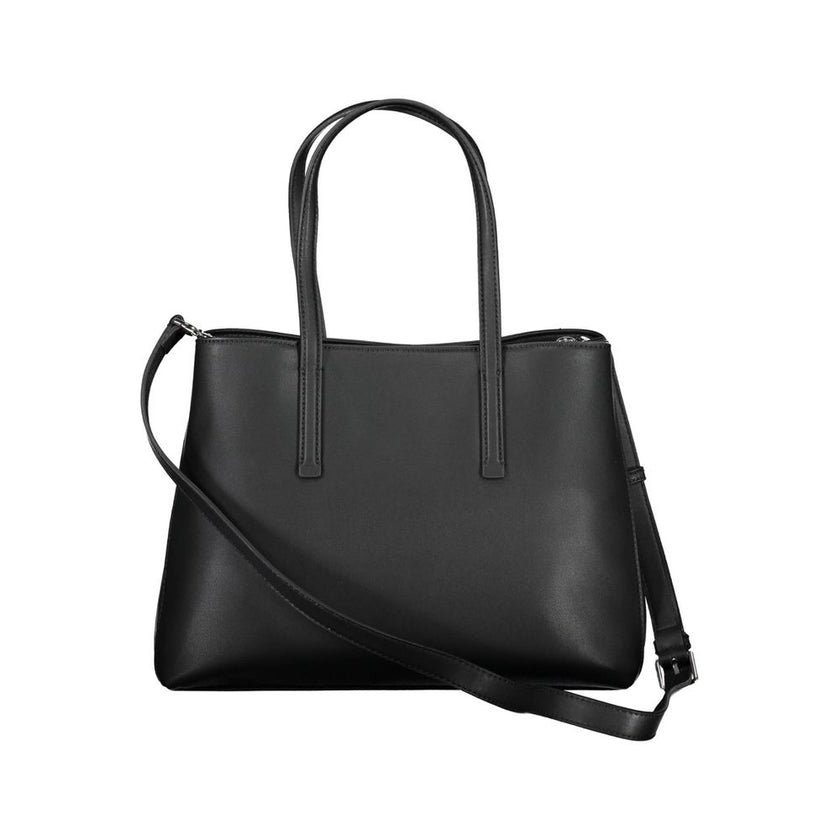 Black Polyester Women HandbagDare to make a statement with the sleek Calvin Klein handbag, designed for the eco-conscious fashionista. Crafted with 100% recycled polyester, it features a versatile dual-handle design complemented by an adjustable and remov
