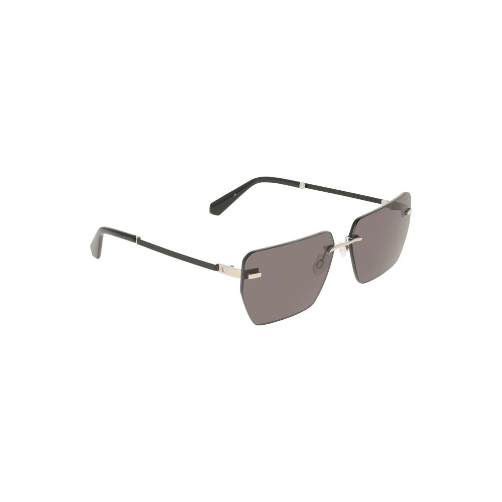 Gray Metal Men SunglassesElevate your style quotient with these sleek Calvin Klein sunglasses. A perfect symphony of design and elegance, these shades boast a bold metal frame that encases smoky square lenses, offering a contemporary twist to your classic