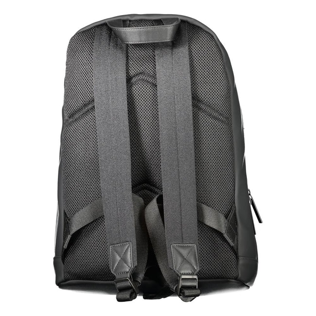 Black Polyester Men BackpackDiscover the epitome of urban sophistication with Calvin Klein’s sleek black backpack, designed for the modern trendsetter. Crafted to perfection with 51% sturdy polyester and a conscious touch of 49% polyethylene, this backpac