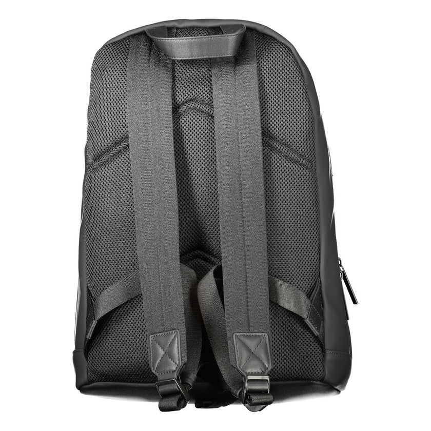 Black Polyester Men BackpackDiscover the epitome of urban sophistication with Calvin Klein’s sleek black backpack, designed for the modern trendsetter. Crafted to perfection with 51% sturdy polyester and a conscious touch of 49% polyethylene, this backpac