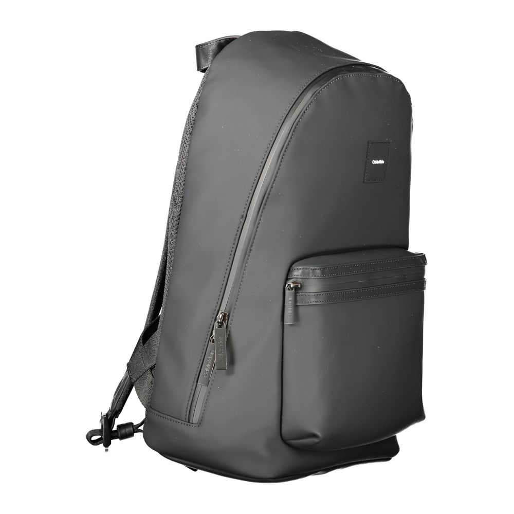 Black Polyester Men BackpackDiscover the epitome of urban sophistication with Calvin Klein’s sleek black backpack, designed for the modern trendsetter. Crafted to perfection with 51% sturdy polyester and a conscious touch of 49% polyethylene, this backpac
