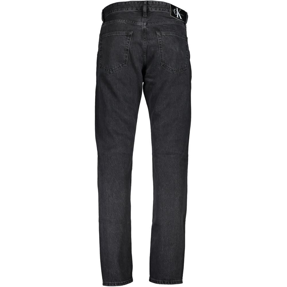 Black Cotton Men JeansElevate your denim collection with the quintessential boldness of Calvin Klein. These dad jeans offer a modern twist on a classic, featuring a washed effect that exudes laid-back sophistication. Crafted from quality materials includi