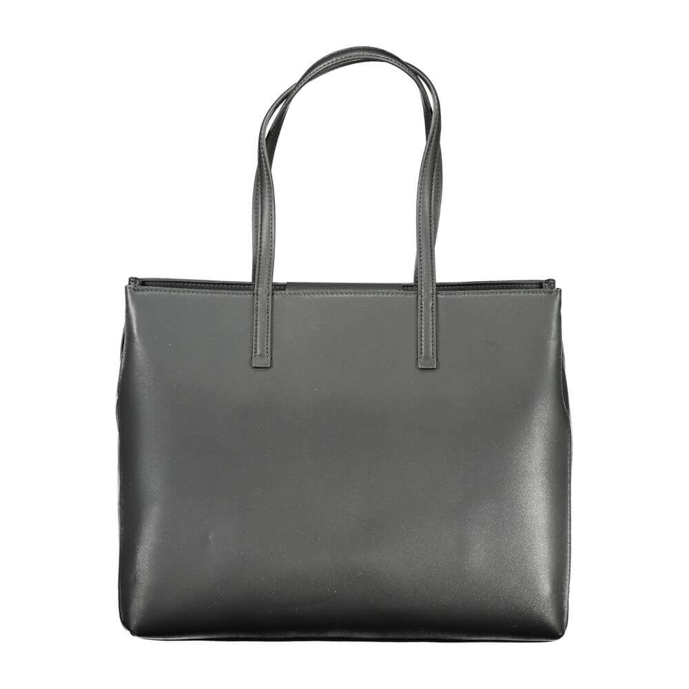 Black Polyester Women HandbagElevate your accessory edit with the exquisite Calvin Klein handbag, a masterpiece of both form and function. It boasts dual shoulder straps for ease of carry, a chic external pocket, and multiple compartments that ensure all
