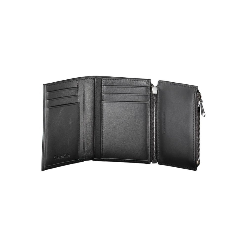 Black Leather Men WalletStep into the epitome of timeless elegance with Calvin Klein’s sleek black wallet. Engineered for both style and security, this accessory boasts a sophisticated leather construction that ensures durability and a luxurious feel. Wit
