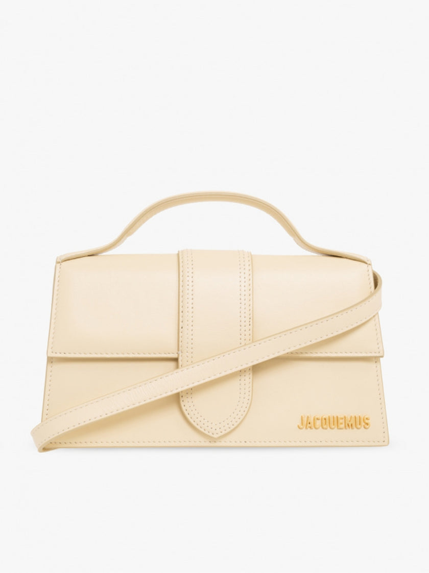 Le Grand Bambino Beige BagJACQUEMUS Gorgeous brand new, 100% Authentic Jacquemus Le Grand Bambino Beige Bag. Model: 213BA007-3060-120 Color: Beige with Gold Hardware Material: Leather Beige with adjustable shoulder strap – Small handle – Removable shoulde