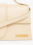 Le Grand Bambino Beige BagJACQUEMUS Gorgeous brand new, 100% Authentic Jacquemus Le Grand Bambino Beige Bag. Model: 213BA007-3060-120 Color: Beige with Gold Hardware Material: Leather Beige with adjustable shoulder strap – Small handle – Removable shoulde
